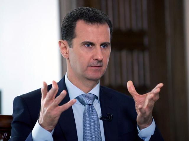 A hand out picture released by the official Syrian Arab News Agency (SANA) shows President Bashar al-Assad speaking to a journalist during an interview with Russia's RIA Novosti state news agency. (AFP Photo) A hand out picture released by the official Syrian Arab News Agency (SANA) shows President Bashar al-Assad speaking to a journalist during an interview with Russia's RIA Novosti state news agency. (AFP Photo)