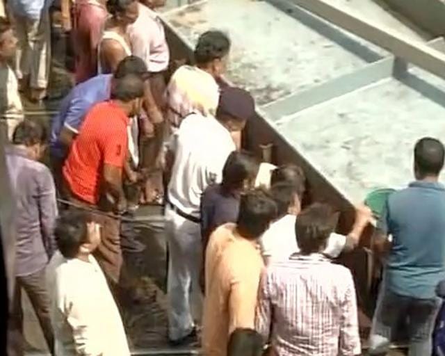 Police officials and rescue workers look for people trapped under the rubble. (ANI) Police officials and rescue workers look for people trapped under the rubble. (ANI)