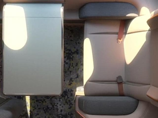 In addition to a table, there would be space to hang clothes, drawers for personal belongings and a tablet computer to control functions. (seymourpowell.com)