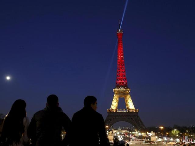 The Eiffel Tower lit up again, this time in the black, yellow and red colours of the Belgian flag, to pay tribute to the victims of bomb attacks in Brussels on March 22, 2016. (REUTERS) 