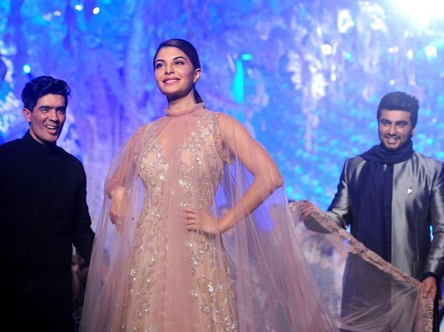 Jacqueline Fernandez (C) and Arjun Kapoor (R) showcase creations by designer Manish Malhotra at a Lakme Fashion Week Summer 2016. (AFP) Jacqueline Fernandez (C) and Arjun Kapoor (R) showcase creations by designer Manish Malhotra at a Lakme Fashion Week Summer 2016. (AFP)