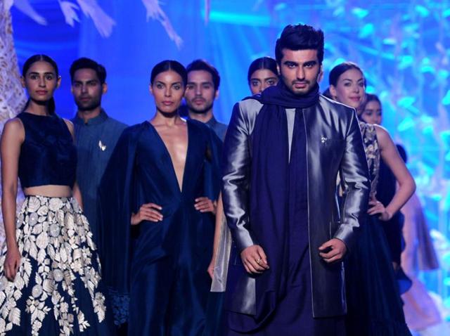 Arjun Kapoor showcases a creations by designer Manish Malhotra at a Lakme Fashion Week Summer 2016 show in Mumbai. (AFP) Arjun Kapoor showcases a creations by designer Manish Malhotra at a Lakme Fashion Week Summer 2016 show in Mumbai. (AFP)