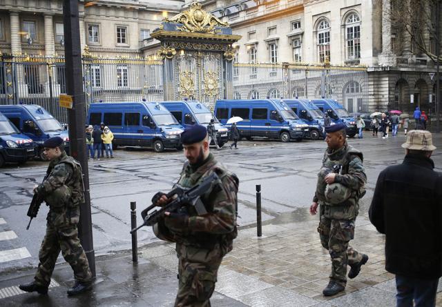 French soldiers patrol outside the Paris hall of Justice, Wednesday. (AP Photo) French soldiers patrol outside the Paris hall of Justice, Wednesday. (AP Photo)