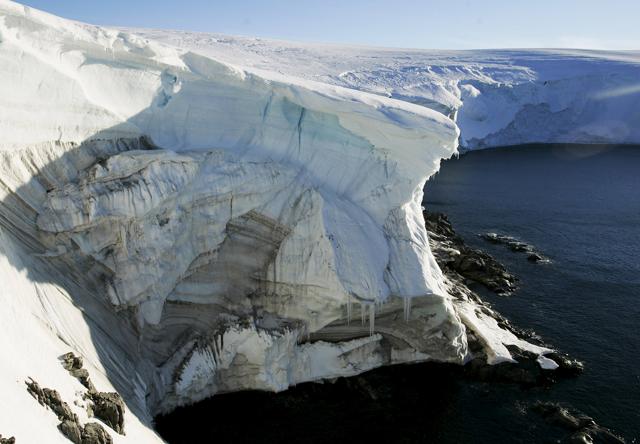 Melting ice shows through at a cliff face at Landsend, on the coast of Cape Denison in Antarctica. (REUTERS File Photo) Melting ice shows through at a cliff face at Landsend, on the coast of Cape Denison in Antarctica. (REUTERS File Photo)