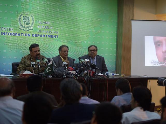 Pakistani Lt Gen Asim Bajwa (L) speaks with the media as he gives details of an arrested man, Kulbhushan Yadav (R on screen), who Islamabad says is an Indian spy. (AFP) Pakistani Lt Gen Asim Bajwa (L) speaks with the media as he gives details of an arrested man, Kulbhushan Yadav (R on screen), who Islamabad says is an Indian spy. (AFP)