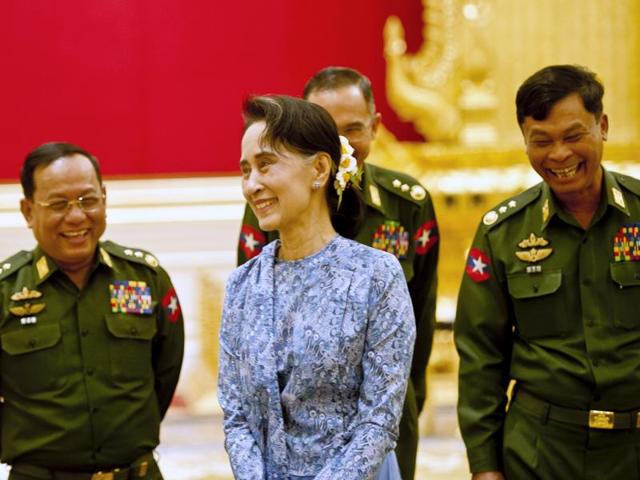 Myanmar democracy icon Aung San Suu Kyi leaves after meeting members of Parliament belonging to her political party National League for Democracy (NLD). (AFP Photo) Myanmar democracy icon Aung San Suu Kyi leaves after meeting members of Parliament belonging to her political party National League for Democracy (NLD). (AFP Photo)