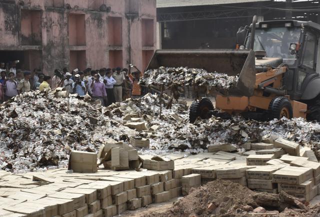 Bottles of country liquor being destroyed on the outskirts of Patna. (AP Dube/HT Photo) Bottles of country liquor being destroyed on the outskirts of Patna. (AP Dube/HT Photo)