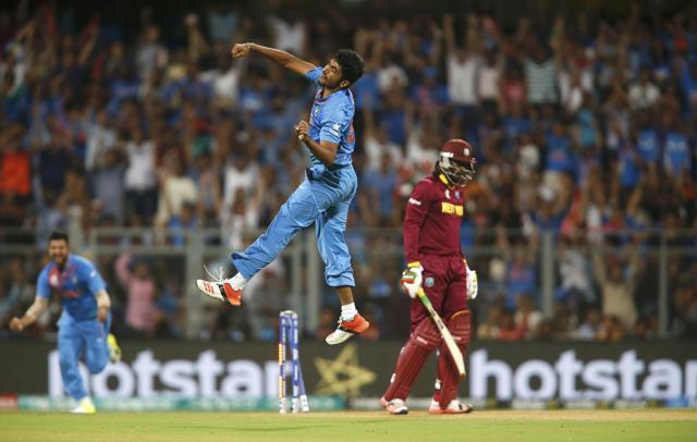 India’s total defence got off to a perfect start as Jasprit Bumrah cleaned up Chris Gayle with a low, swinging full toss on the 7th ball of the innings. (REUTERS) India’s total defence got off to a perfect start as Jasprit Bumrah cleaned up Chris Gayle with a low, swinging full toss on the 7th ball of the innings. (REUTERS)