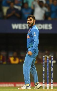 India's Virat Kohli not only scored with the bat, but also took the wicket of West Indies batsman Johnson Charles. (AFP) India's Virat Kohli not only scored with the bat, but also took the wicket of West Indies batsman Johnson Charles. (AFP)