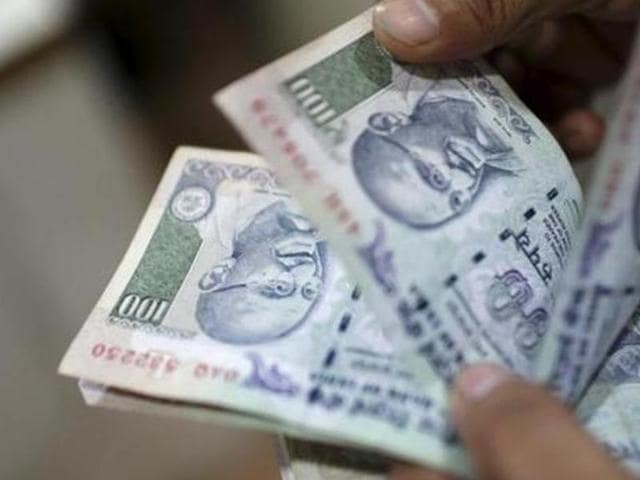 An employee counts currency notes in New Delhi in this July 5, 2013 file photo. Interest rates on small saving schemes including PPF have been slashed from April 1, 2016.(REUTERS) An employee counts currency notes in New Delhi in this July 5, 2013 file photo. Interest rates on small saving schemes including PPF have been slashed from April 1, 2016.(REUTERS)