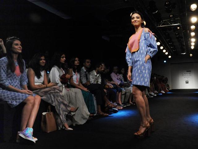 Actor Mandana Karimi (L) cheers as fellow actor Radhika Apte (R) poses on the opening day of the Lakme Fashion Week (LFW) in Mumbai on Thursday. (AFP) Actor Mandana Karimi (L) cheers as fellow actor Radhika Apte (R) poses on the opening day of the Lakme Fashion Week (LFW) in Mumbai on Thursday. (AFP)