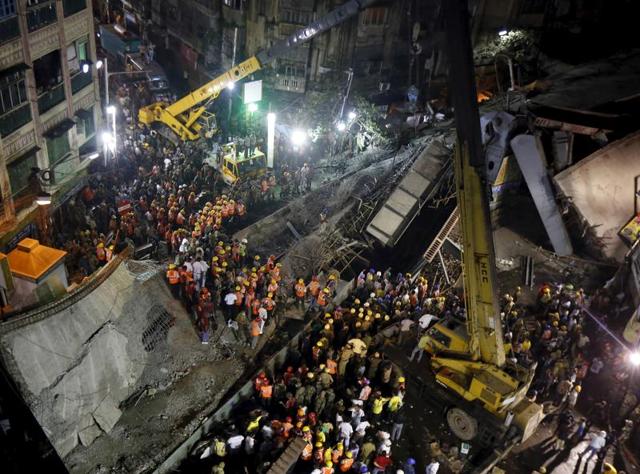 An under-construction flyover collapsed on Thursday in a congested market in central Kolkata, killing at least two dozen people and trapping hundreds underneath it. The opposition is blaming the state government is hopes to use the tragedy to dent the Trinamool Congress’ chances in the assembly polls. (Rupak De Chowdhuri/Reuters) An under-construction flyover collapsed on Thursday in a congested market in central Kolkata, killing at least two dozen people and trapping hundreds underneath it. The opposition is blaming the state government is hopes to use the tragedy to dent the Trinamool Congress’ chances in the assembly polls. (Rupak De Chowdhuri/Reuters)
