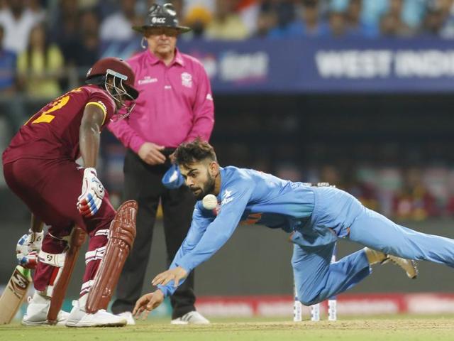 India's Virat Kohli fields the ball during their ICC World Twenty20 2016 cricket semifinal match against the West Indies at Wankhede stadium in Mumbai, Thursday, March 31, 2016.(AP)