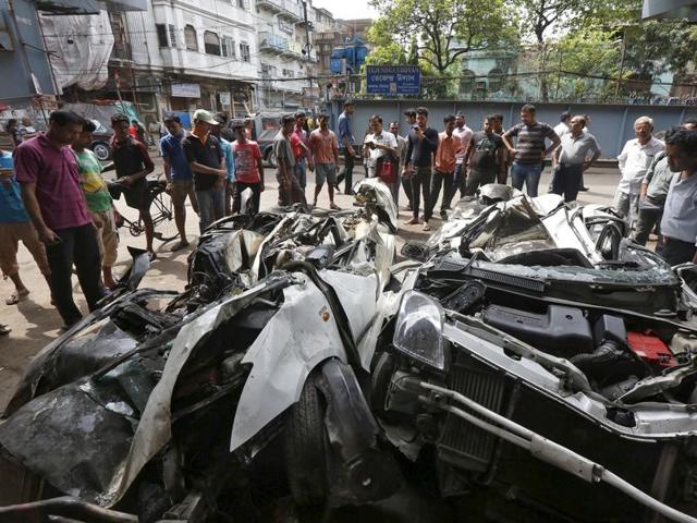 Rescue workers clear away debris amid efforts to free people trapped under the wreckage of a collapsed flyover bridge in Kolkata (AFP) Rescue workers clear away debris amid efforts to free people trapped under the wreckage of a collapsed flyover bridge in Kolkata (AFP)