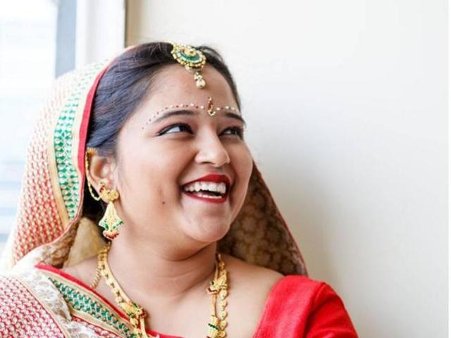 An Indian bride is all smiles. (INSTAGRAM/harshabathija) 