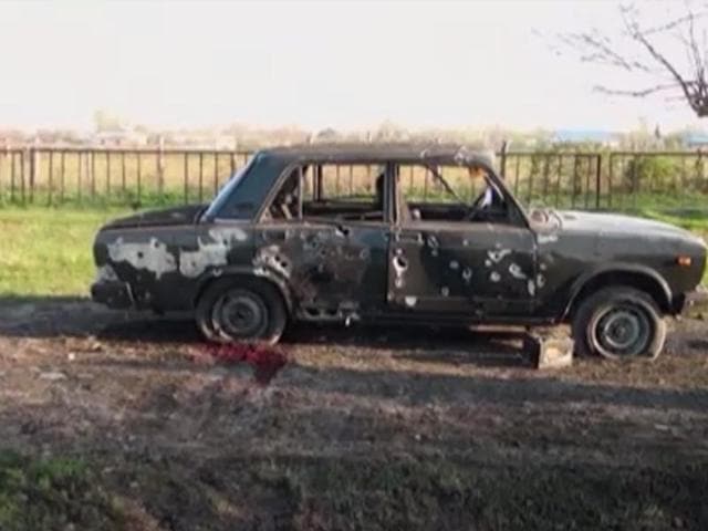 In this image from TV, a car destroyed with blood showing in the aftermath after heavy fighting erupted in Terter, Azerbaijan (AP) In this image from TV, a car destroyed with blood showing in the aftermath after heavy fighting erupted in Terter, Azerbaijan (AP)