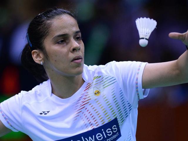 India's Saina Nehwal serves during her women's singles semi-final match against China's Li Xuerui. (AFP Photo) India's Saina Nehwal serves during her women's singles semi-final match against China's Li Xuerui. (AFP Photo)