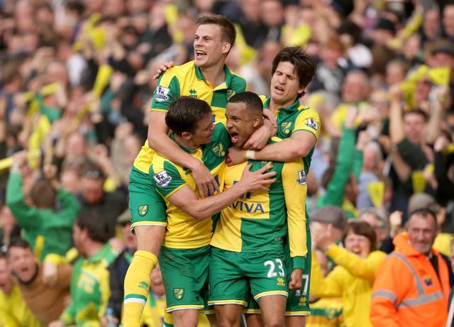Norwich City's Martin Olsson, second right, celebrates scoring the winning goal with teammates, during the English Premier League soccer match between Norwich City FC and Newcastle United. (AP Photo) Norwich City's Martin Olsson, second right, celebrates scoring the winning goal with teammates, during the English Premier League soccer match between Norwich City FC and Newcastle United. (AP Photo)