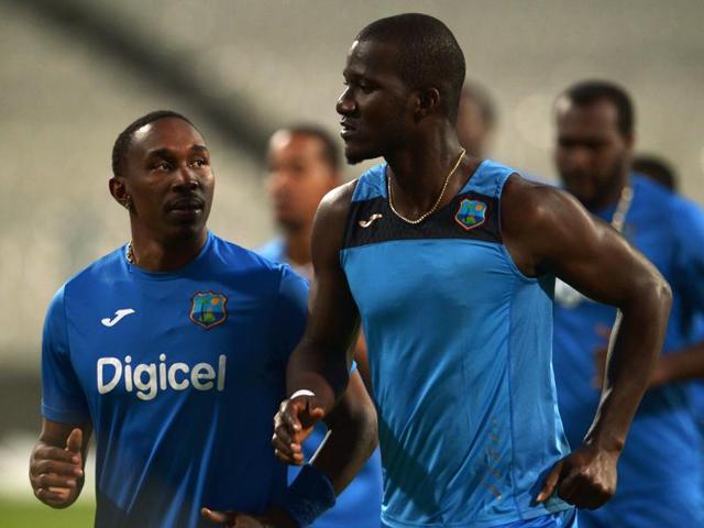 West Indies's captain Darren Sammy and teammate Dwayne Bravo jog during a training session. (AFP Photo) West Indies's captain Darren Sammy and teammate Dwayne Bravo jog during a training session. (AFP Photo)