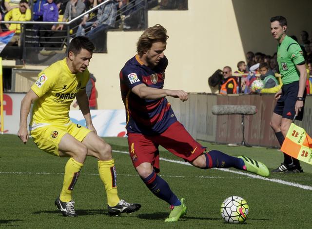 Barcelona's Ivan Rakitic (right) has a pass success rate of close to 90 per cent. (REUTERS)