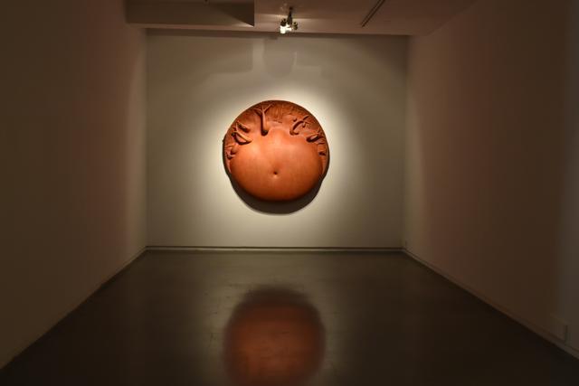 Mother at the Forest (acrylic on fibreglass and marble dust, 2009). Dimension: 60 inches diameter X 10.25 inches. The artist creates what looks like a symbol of motherhood. The fruit-bearing trees on the edge also symbolise creation. (Saumya Khandelwal/HT Photo)