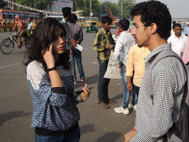 Students standing outside their exam center in Lucknow on Sunday. (Deepak Gupta/ Hindustan Times)