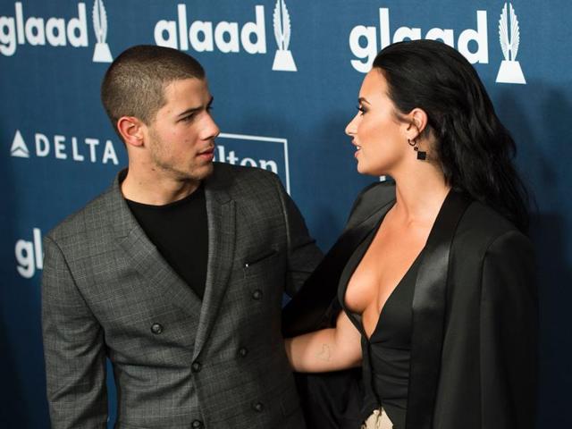 Nick Jonas (L) and Demi Lovato attend the awards. (AFP)