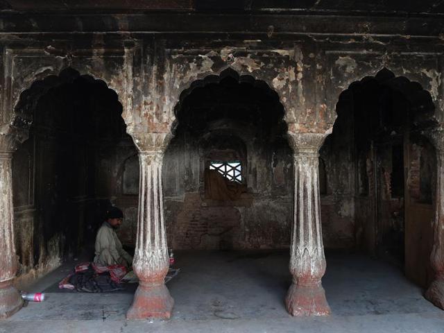 An Indian man sits inside the tomb of Atgah Khan in the Nizamuddin area of New Delhi.(AFP Photo) An Indian man sits inside the tomb of Atgah Khan in the Nizamuddin area of New Delhi.(AFP Photo)