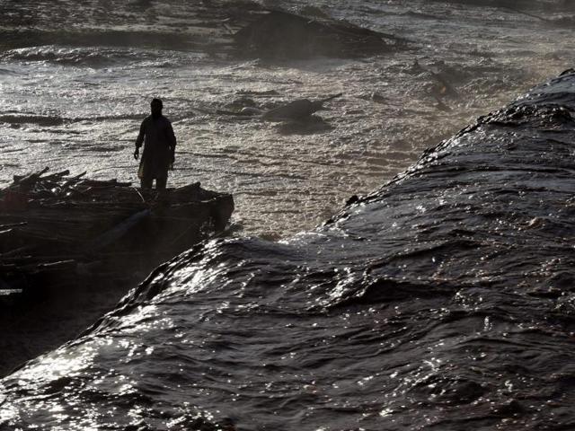 A Pakistani vendor tries to salvage materials after flood water destroyed his shop following heavy rains on the outskirts of Peshawar on Monday. (AFP) A Pakistani vendor tries to salvage materials after flood water destroyed his shop following heavy rains on the outskirts of Peshawar on Monday. (AFP)