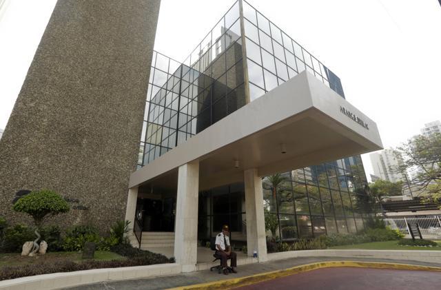 A security guard sit outside the the Mossack Fonseca law firm in Panama City. (AP) A security guard sit outside the the Mossack Fonseca law firm in Panama City. (AP)