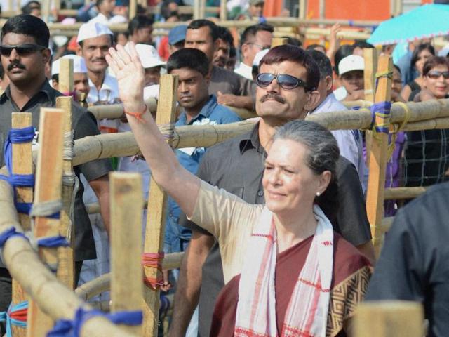 Congress president Sonia Gandhi waves at the crowd at an election rally at Biswanath Chariali in Sonitpur district, Assam. (PTI Photo) Congress president Sonia Gandhi waves at the crowd at an election rally at Biswanath Chariali in Sonitpur district, Assam. (PTI Photo)