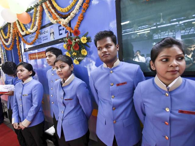As melodies floated through the air at the station, train stewards and hostesses welcomed the passengers with roses on board the Gatimaan Express. (Arun Sharma / HT Photo)