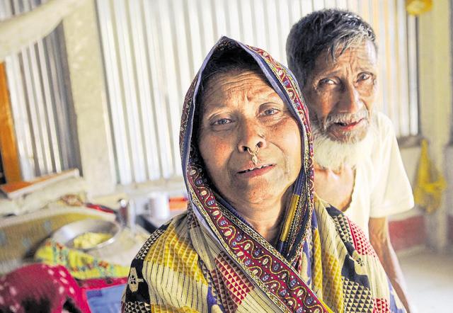 Grieving parents of Moinal Mollah, who has been in the Goalpara detention camp since 2013. Moinal's father, Ashan, and mother, Manowara Khatoon – once D-voters – were declared Indian citizens by a tribunal but he was declared a foreigner. (Subhendu Ghosh / Hindustan Times) Grieving parents of Moinal Mollah, who has been in the Goalpara detention camp since 2013. Moinal's father, Ashan, and mother, Manowara Khatoon – once D-voters – were declared Indian citizens by a tribunal but he was declared a foreigner. (Subhendu Ghosh / Hindustan Times)