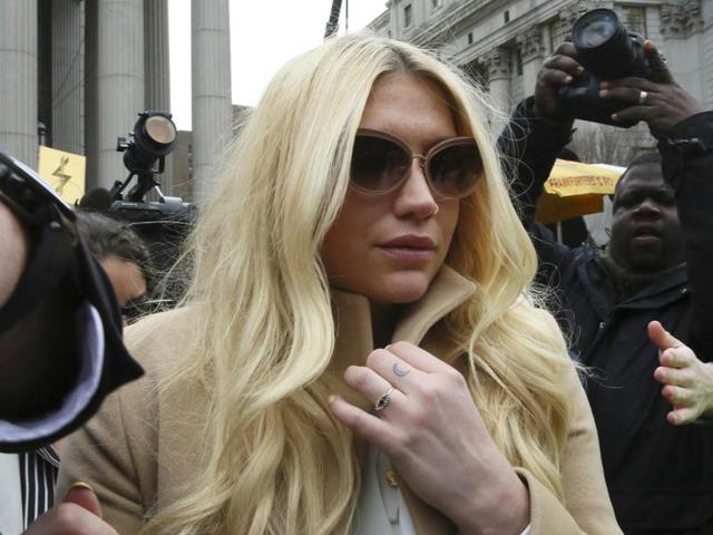 A protester holds a sign with the hashtag #freekesha on it while demonstrating in support of the singer Kesha outside of Sony headquarters in New York on March 11, 2016.(REUTERS) A protester holds a sign with the hashtag #freekesha on it while demonstrating in support of the singer Kesha outside of Sony headquarters in New York on March 11, 2016.(REUTERS)