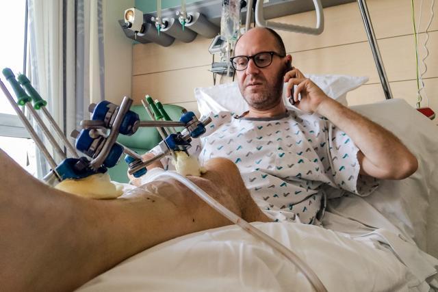 Walter Benjamin makes a phone call as he rests in his bed in Jette University Hospital in Brussels. (AP) Walter Benjamin makes a phone call as he rests in his bed in Jette University Hospital in Brussels. (AP)