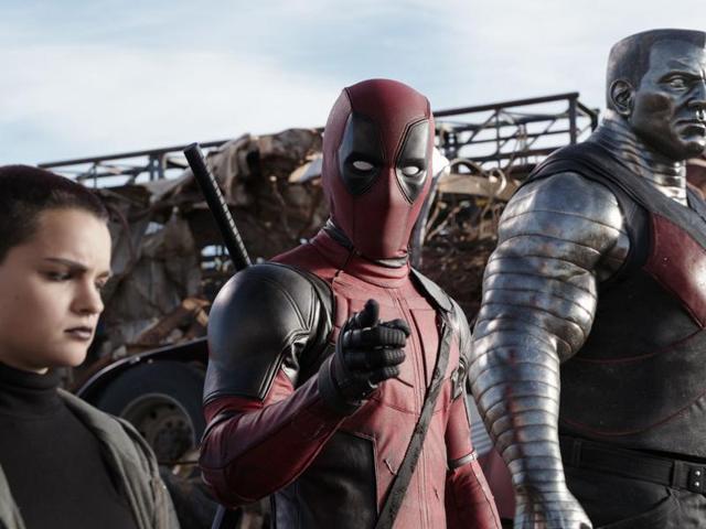 Deadpool (Ryan Reynolds) pauses from a life-and-death battle to break the fourth wall, much to the dismay of his comrades Negasonic Teenage Warhead (Brianna Hildebrand) and Colossus (voiced by Stefan Kapicic).