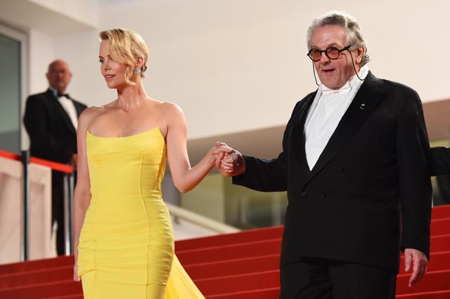 Theron with Australian director George Miller, creator of Mad Max: Fury Road, leaving the Festival palace after the screening of the film during the 68th Cannes Film Festival in Cannes. (AFP) Theron with Australian director George Miller, creator of Mad Max: Fury Road, leaving the Festival palace after the screening of the film during the 68th Cannes Film Festival in Cannes. (AFP)