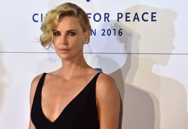 Theron poses for photographers as she arrives for the Cinema for Peace event at the Konzerthaus in Berlin on 15 February. (AFP) Theron poses for photographers as she arrives for the Cinema for Peace event at the Konzerthaus in Berlin on 15 February. (AFP)