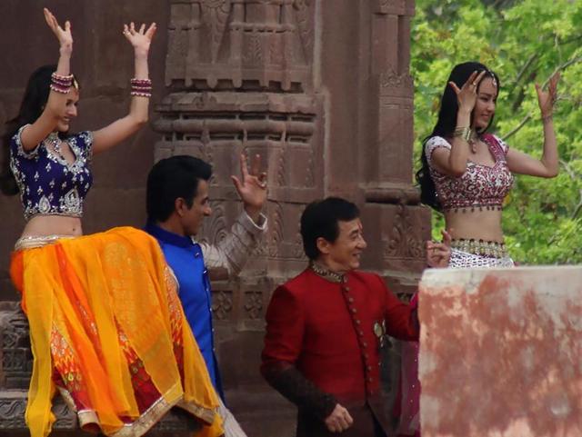 Jackie Chan, Sonu Sood and actress Amrya Dastur dance on set with other performers as they shoot a scene of the forthcoming film Kung Fu Yoga. (AFP) 