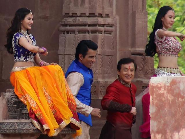 Jackie Chan, Sonu Sood and actress Amrya Dastur dance on set with other performers as they shoot a scene of the forthcoming film Kung Fu Yoga. (AFP) 