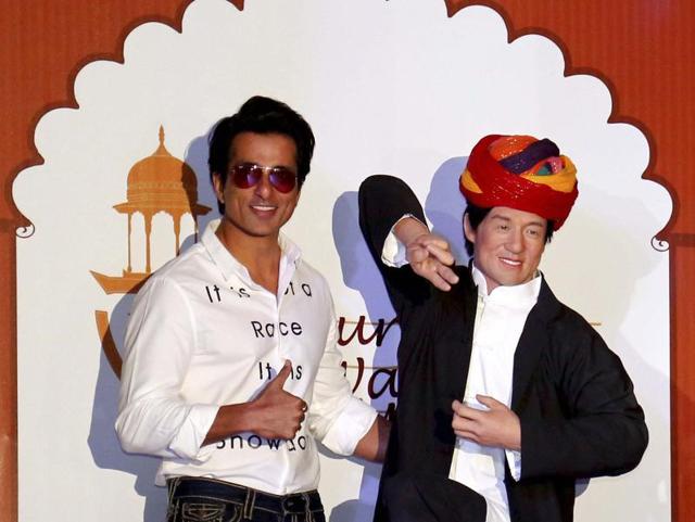 Actor Sonu Sood poses with a wax statue of Hollywood superstar Jackie Chan after unveiling it at Nahargarh Fort Museum in Jaipur on Tuesday.  (PTI) 