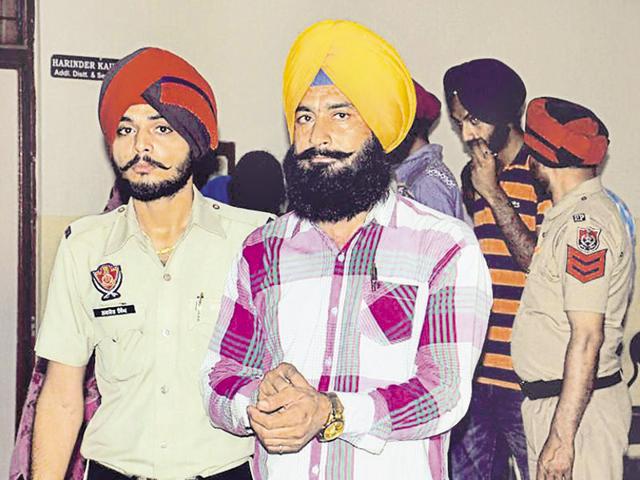 Father-in-law of the victim, Amrik Singh, who was awarded life term, coming out the district courts in Patiala on Monday. (HT Photo) Father-in-law of the victim, Amrik Singh, who was awarded life term, coming out the district courts in Patiala on Monday. (HT Photo)