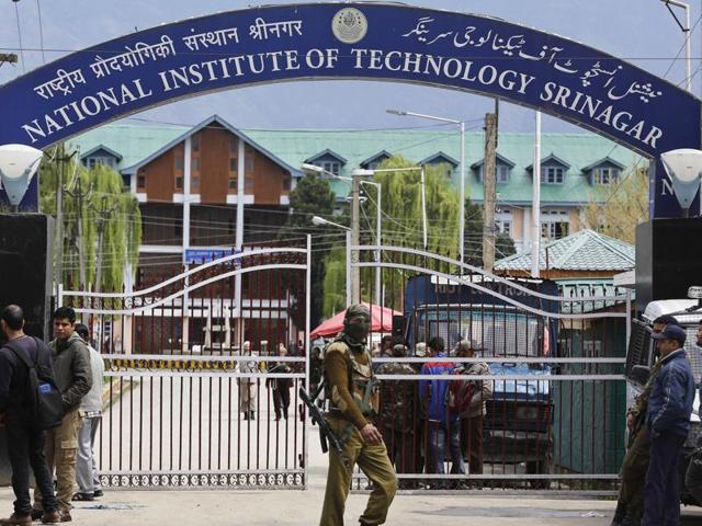 Security guards at the entrance of National Institute of Technology (NIT) Srinagar on Thursday. Classes had to be suspended after several students sustained injuries. (AP) Security guards at the entrance of National Institute of Technology (NIT) Srinagar on Thursday. Classes had to be suspended after several students sustained injuries. (AP)