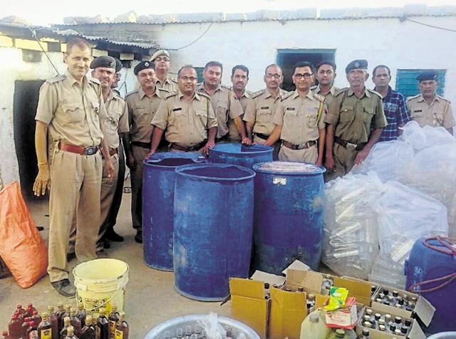 Police, excise officials with liquor-making materials seized(HT Photo)