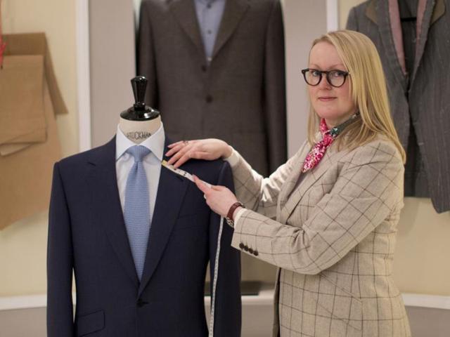 British master tailor Kathryn Sargent poses at her shop on Savile Row in central London on Wednesday. (AFP) British master tailor Kathryn Sargent poses at her shop on Savile Row in central London on Wednesday. (AFP)