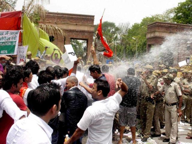 Police in action against ABVP activists during a protest over the four-year undergraduate programme (FYUP) of Delhi University in New Delhi. (PTI Photo) Police in action against ABVP activists during a protest over the four-year undergraduate programme (FYUP) of Delhi University in New Delhi. (PTI Photo)