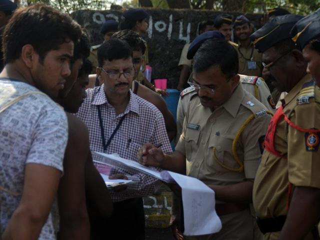 Candidates register themselves for the Maharashtra State Police Recruitment test on the Eastern Express Highway in Mumbai on Wednesday. (Prashant Waydande) 