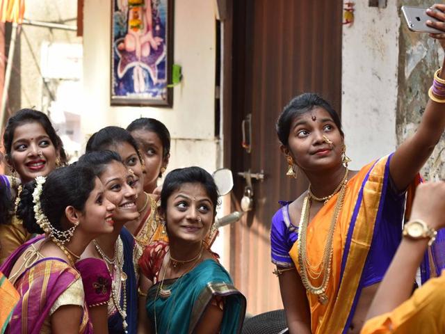 Girls take selfie duing Gudi Padwa procession at Girgaum in Mumbai. (Pratham Gokhale/ Hindustan Times)