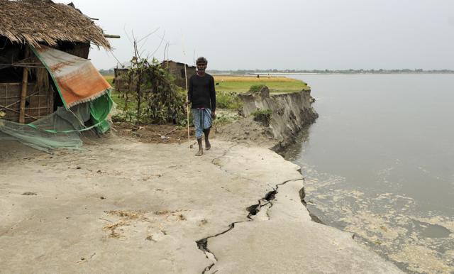 Aamir Ali, 40, who lives on the Kathalguri char, lost his house to river erosion around two months ago. He has moved six times in the past five years. (Subhendu Ghosh / HT photo) Aamir Ali, 40, who lives on the Kathalguri char, lost his house to river erosion around two months ago. He has moved six times in the past five years. (Subhendu Ghosh / HT photo)