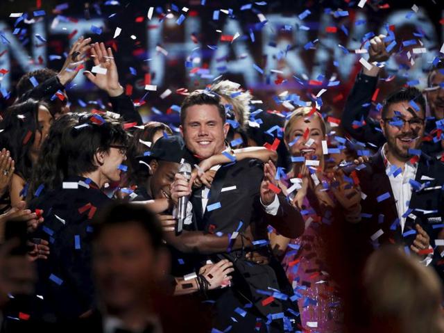 Trent Harmon was adjudged the final champion at the end of a two-hour-plus series finale. He is congratulated after winning the competition. (REUTERS) 